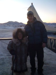 Trent with a 98 yr old woman in Western Alaska, who made him a fur hat from beaver and seal.