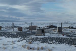 Dog houses on the Bering Sea coast. Ever wonder what's the story behind a photograph?